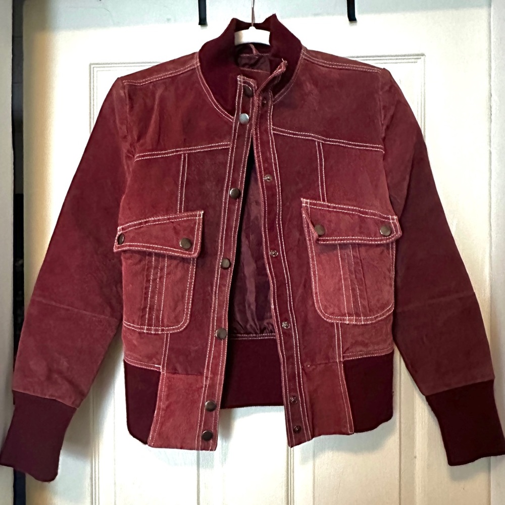 Beautiful vintage wine red leather jacket. Outer is 100% leather.